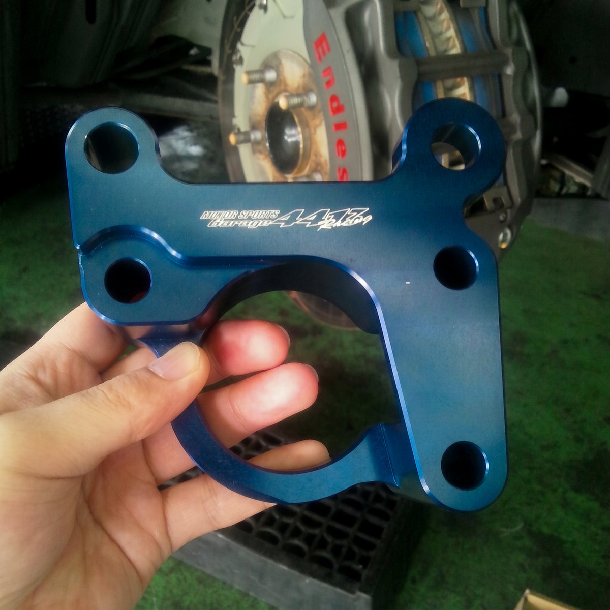 GARAGE4413 pad knockback reduction bracket